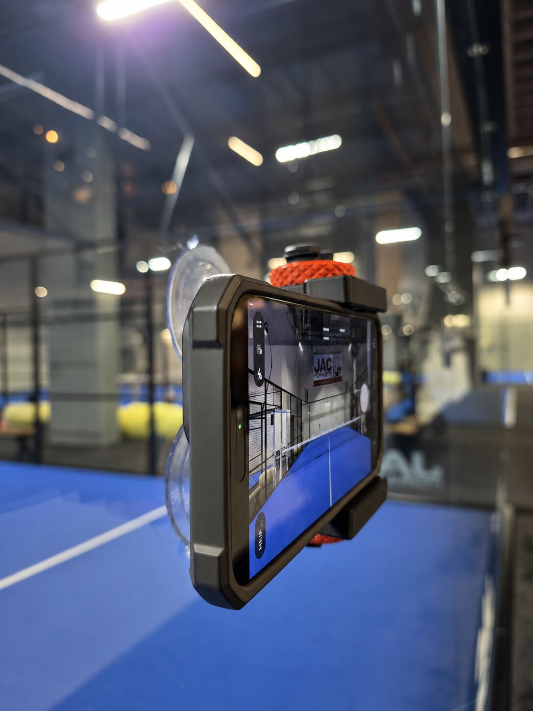 RallyCam mounted on court glass